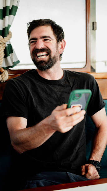 istock Man in his 30’s looking at his cell phone happy 1460905648