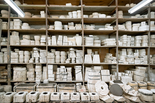 Large number of molds for making ceramic objects in a factory
