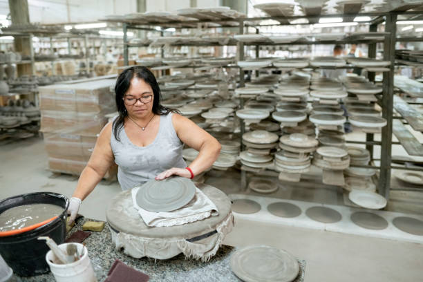 istock Mature woman working in a ceramic factory 1460906288
