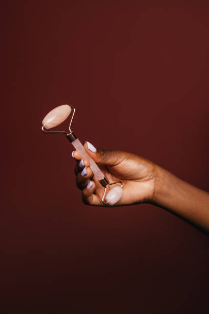 istock An Unrecognizable Woman Using Jade Roller To Relax 1460913324