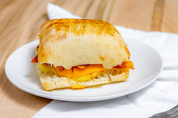 A view of a breakfast sandwich, featuring a sausage patty and eggs.