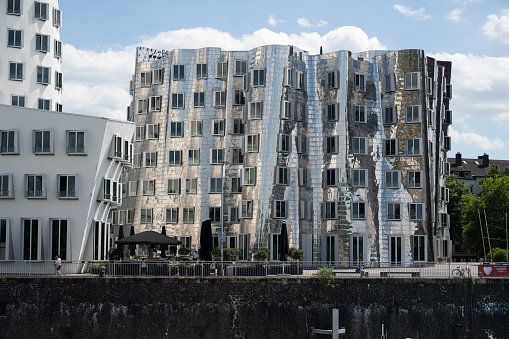 Düsseldorf, Germany - June 28, 2022: Building B of the Neuer Zollhof, designed by Frank Gehry, in the MedienHafen (MediaHarbor).