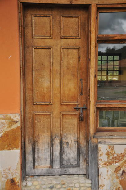 Wooden door in the old house, closeup of photo. Wooden door in the old house, closeup of photo. key pegboard stock pictures, royalty-free photos & images