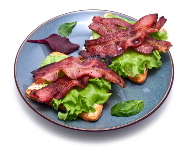 istock bacon and cream cheese sandwiches on a plate isolated on white background 1460921103
