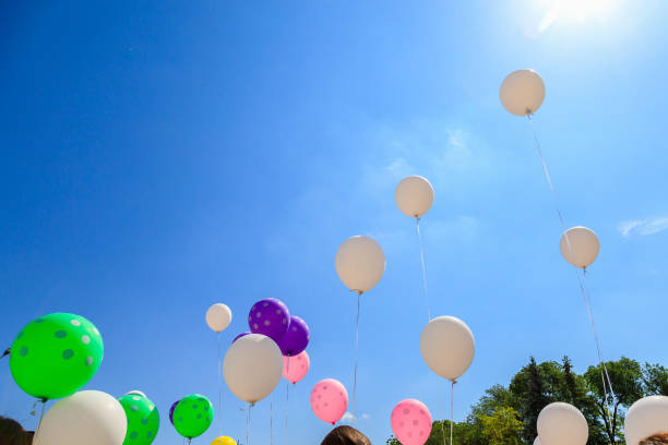istock Balloons released into the sky on a festive day. 1460921690