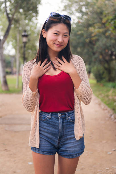 istock beautiful young asian woman looking at camera 1460922671