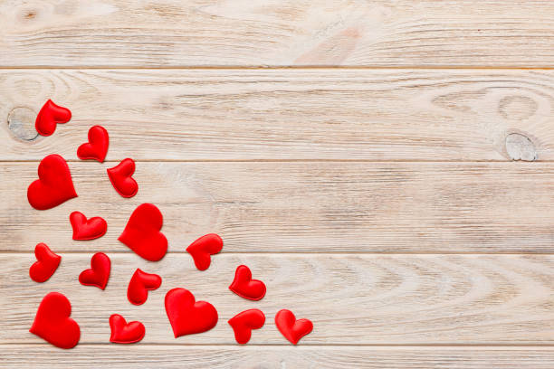istock Valentine day background with red hearts, top view with copy space 1460925572