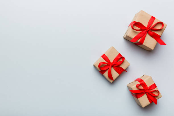 istock Valentine day composition: red gift box with bow and heart. Christmas present. View from above. Space for text. Holday greeting card 1460926024