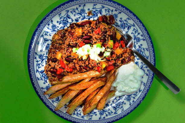 istock Backed chicken cooked with rice and vegetables.Yellow plate. 1460928071