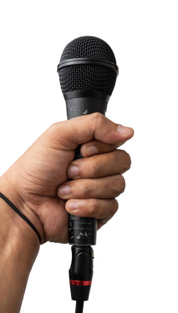 istock Hand holding microphone isolated for music and podcast design element 1460932742