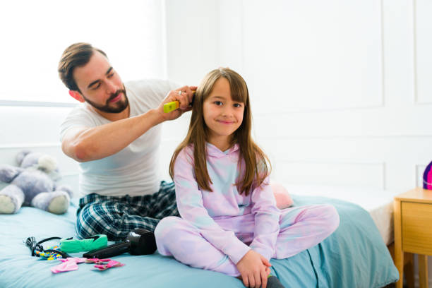istock Little girl getting ready for school with her dad 1460933494