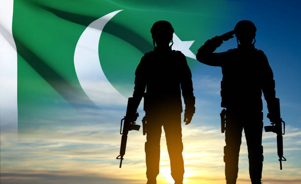 istock Silhouettes of soldiers with Pakistan Flag 1460937605