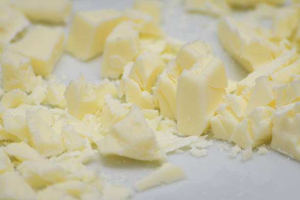 istock Pieces of white chocolante ready to melt and prepare easter eggs 1460939177