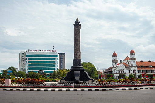Tugu Muda (Young Tower) and Mandala Bhakti Museum in the background, historical landmark and icon of Semarang City, Capital City of Central Java, Indonesia.