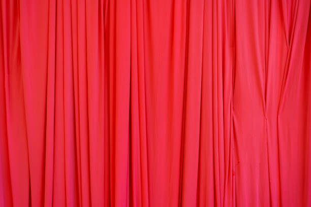 istock Red silk curtains decoration design for scene backdrop or background 1460944127