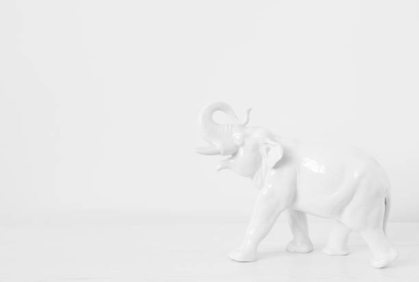 istock white elephant on a white background. porcelain elephant figurine on the table 1460945011