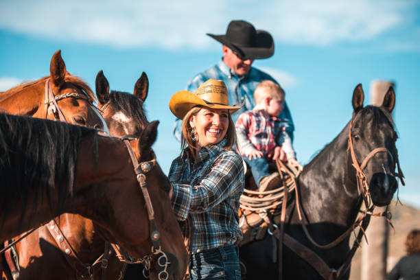 Smiling Family Riding Horses