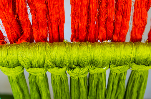 Closeup green and red cotton thread background, Thai cotton thread product display