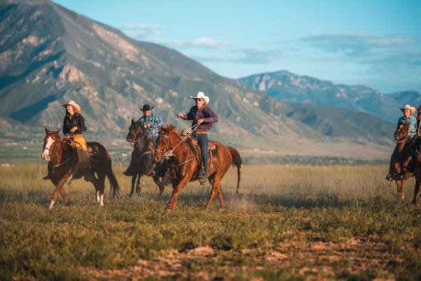 istock Active Citizens Wearing Cowboy Hats and Riding Horses 1460945379