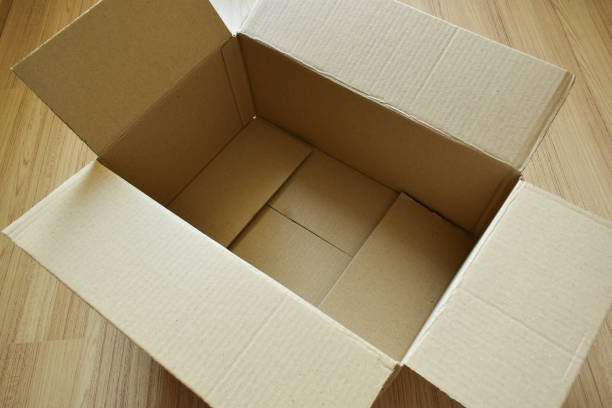 istock brown post box packaging put on wood floor 1460951083