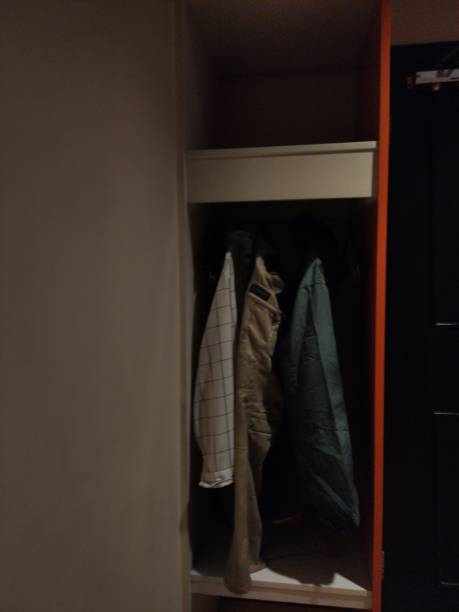 istock Minimalist clothes rack, orange color 1460955873