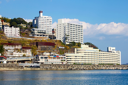 View of apartment buildings and hotels in Atami City, Shizuoka Prefecture, Japan.. Atami is a getaway for people living in the Tokyo area.
