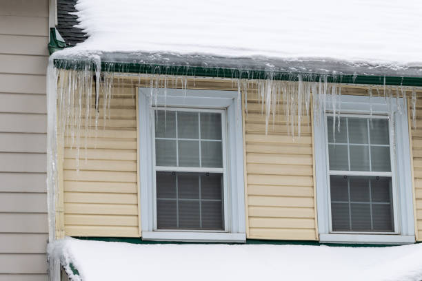 istock Icicles hanging on a house roof in winter 1460956314
