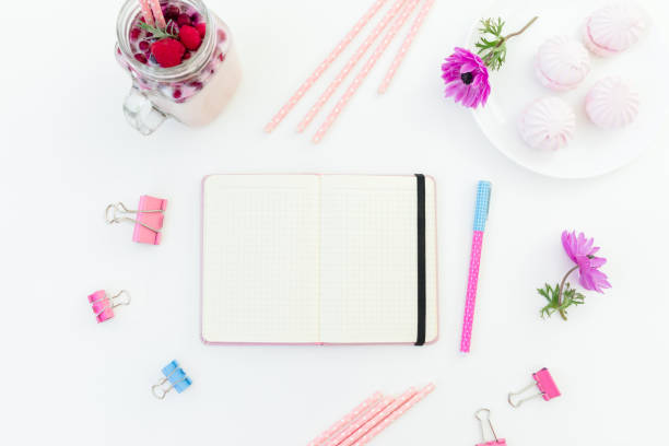 istock Berries smoothie with straws, marshmallow and pink anemones with copy space on white background. Flat lay. 1460957325