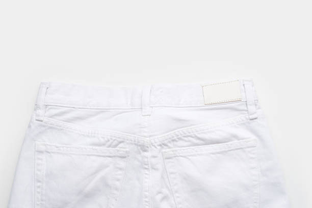 istock White jeans on white background. Monochromatic flatlay 1460962693