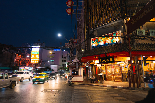 Illuminated Chinatown street in Bangkok at night  shot on film