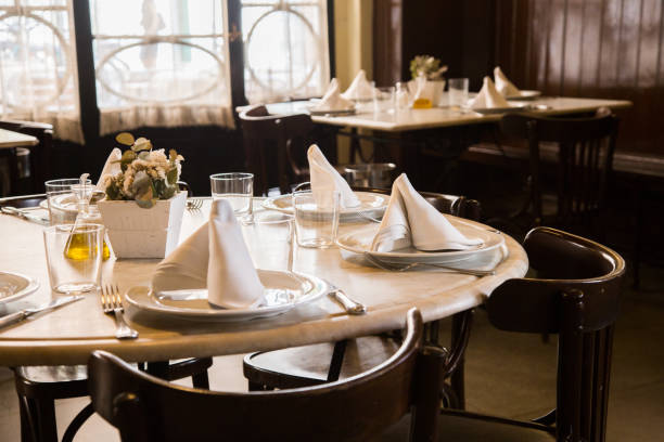 istock Elegant restaurant table with cutlery, crockery and glasses. 1460970458