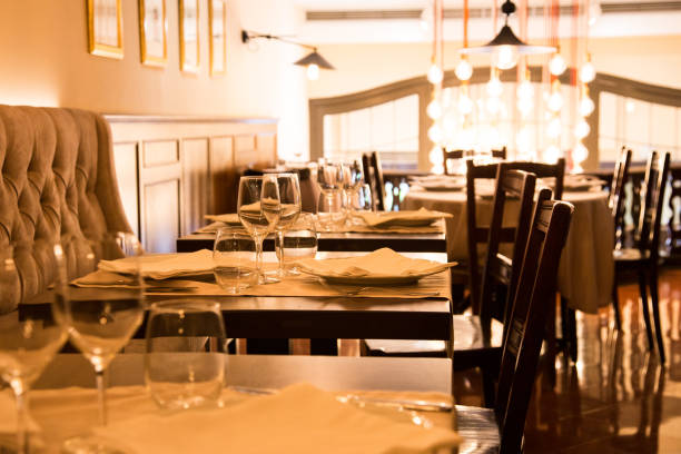 istock Elegant restaurant table with cutlery, crockery and glasses. 1460970459