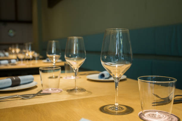 istock Elegant restaurant table with cutlery, crockery and glasses. 1460970581