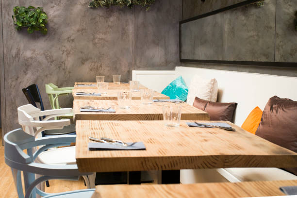 istock Elegant restaurant table with cutlery, crockery and glasses. 1460970611
