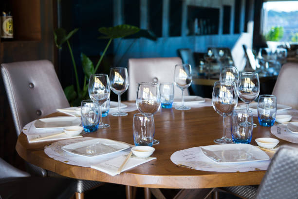 istock Elegant restaurant table with cutlery, crockery and glasses. 1460970812