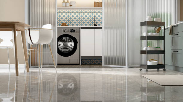 istock Clean gray marble tile floor in contemporary design kitchen with dining table, trolley, children high chair, white frame, reeded glass panel folding door partition to laundry room 1460971158