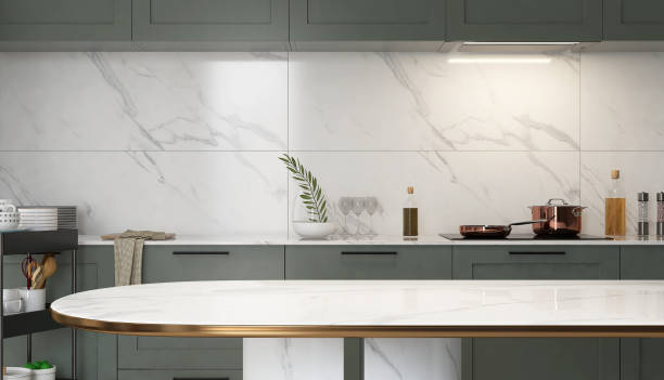 Luxury marble dining table, sage green kitchen counter with white countertop, cooktop, cupboard and white marble splashback