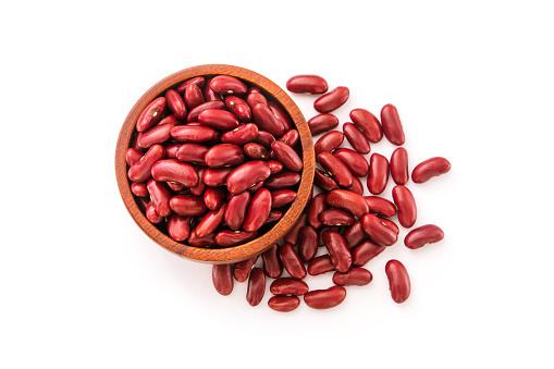 Red beans in wooden bowl with floor isolated on white background , top view , flat lay.