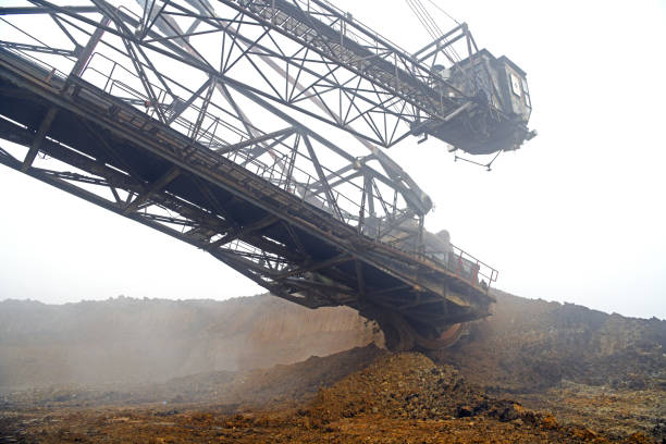 istock Bucket-wheel excavator during excavation at the surface mine. Huge excavator on open pit mine. 1460972684