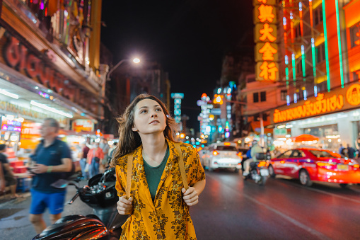 Young Caucasian woman exploring Chinatown in Bangkok, Thailand