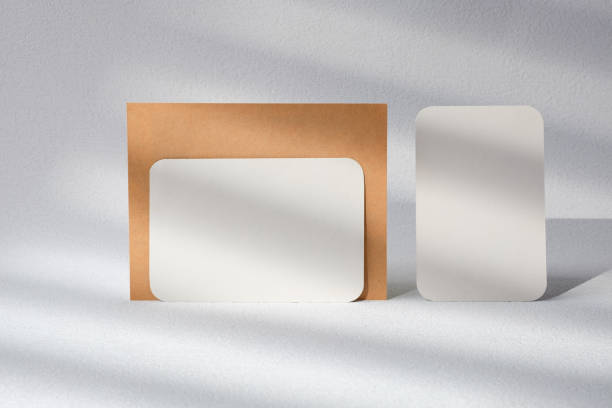istock blank poster card with product display stand with sunlight in white studio 1460978091