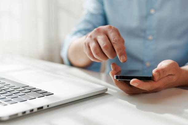 istock Men are typing on smart phones 1460980315