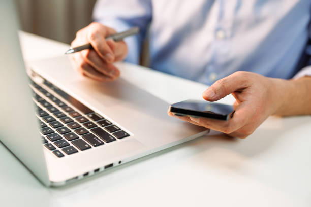istock Men are working with laptops and smartphones 1460980418