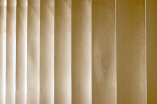 istock Beige colored protective steel construction wall texture with vertical seam. 1460984142