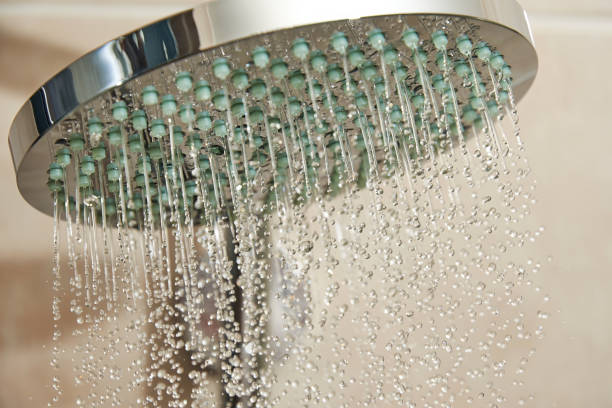 istock Fast water flow from the chrome shower head in the bath cabin 1460985634
