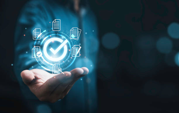 istock Businessman holding virtual glowing correct sign mark and document for online approve  paperless and quality assurance concept. 1460985662