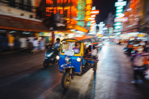 Traffic in crowded  Chinatown street in Bangkok at night