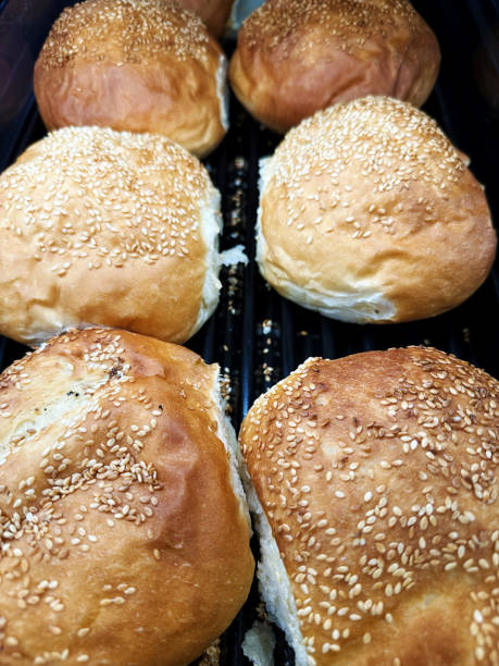 Fresh buns with sesame seeds on the bakery counter
