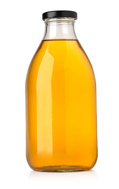 istock Apple juice in a glass bottle. 1460988862