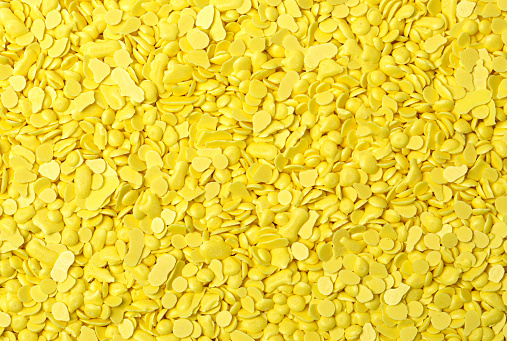 yellow sulfur granules used in medicine, fertilizers. Yellow sulfur background, texture, top view. Heap of sulfur powder, background, texture, top view.